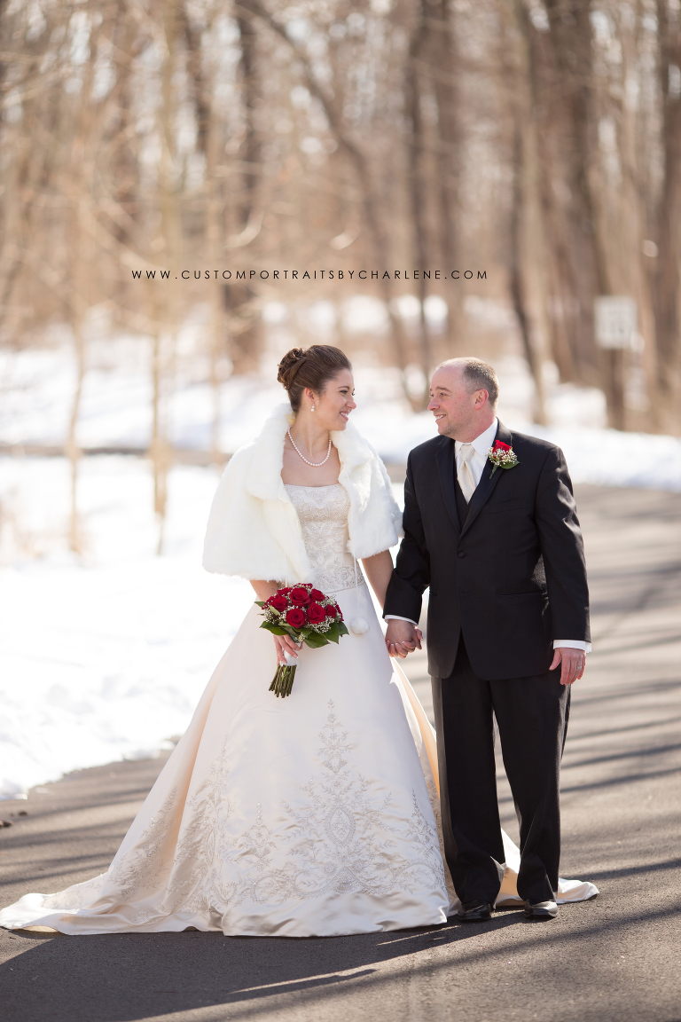 a - snowy wedding portrait ideas - winter wedding pittsburgh - winter wedding inspiration - red roses bridal bouquet - wedding pose ideas